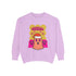 A holiday sweatshirt featuring a cute ghost character wearing a Santa hat, with two smaller ghosts on either side. Above them is the playful text "Boo Humbug," surrounded by snowflakes and festive elements. The design humorously combines spooky and festive themes for a unique holiday look.